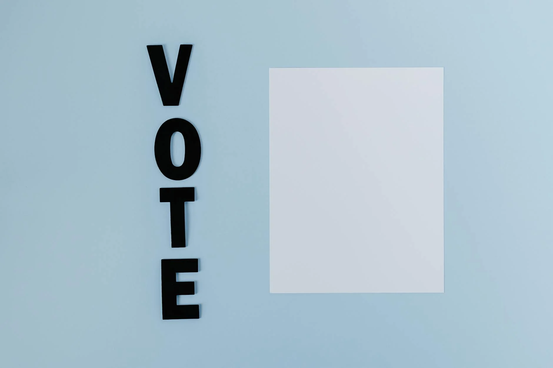 Simple design with 'Vote' letters and blank space on light background.