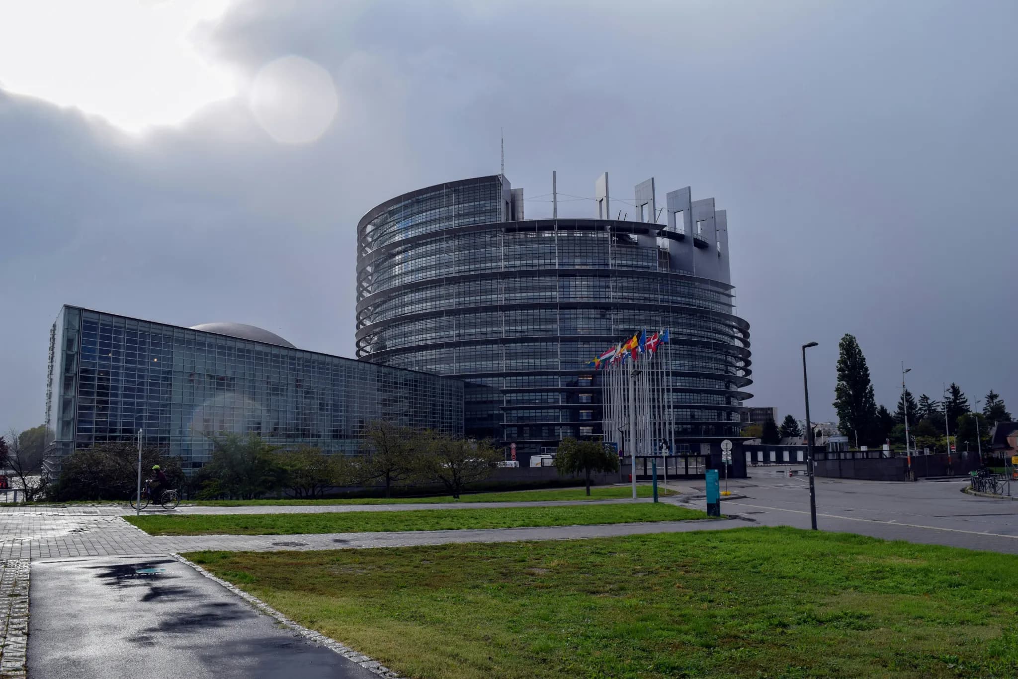 gray concrete building near green grass field during daytime