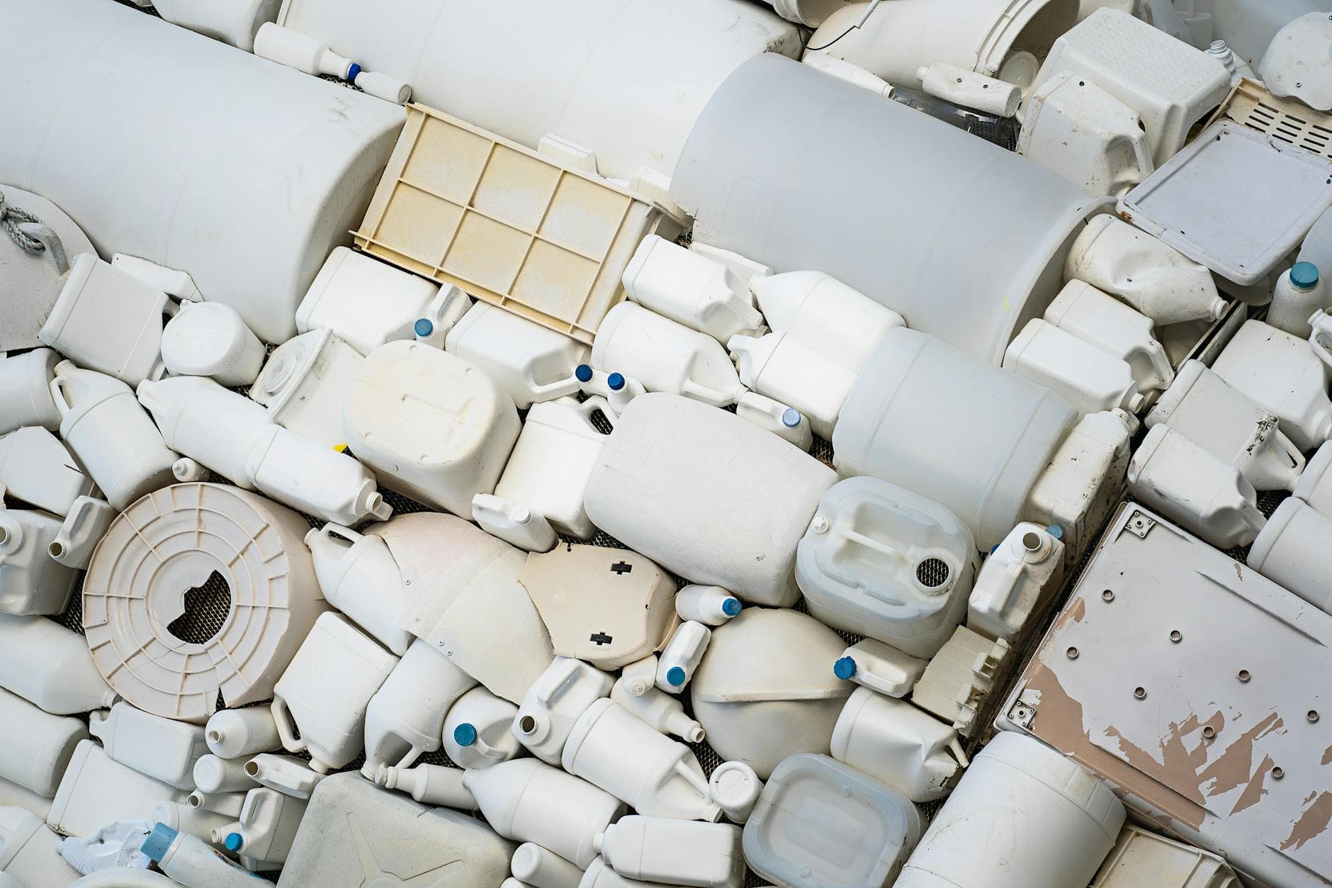 A pile of assorted recyclable plastic containers highlighting the issue of plastic waste.