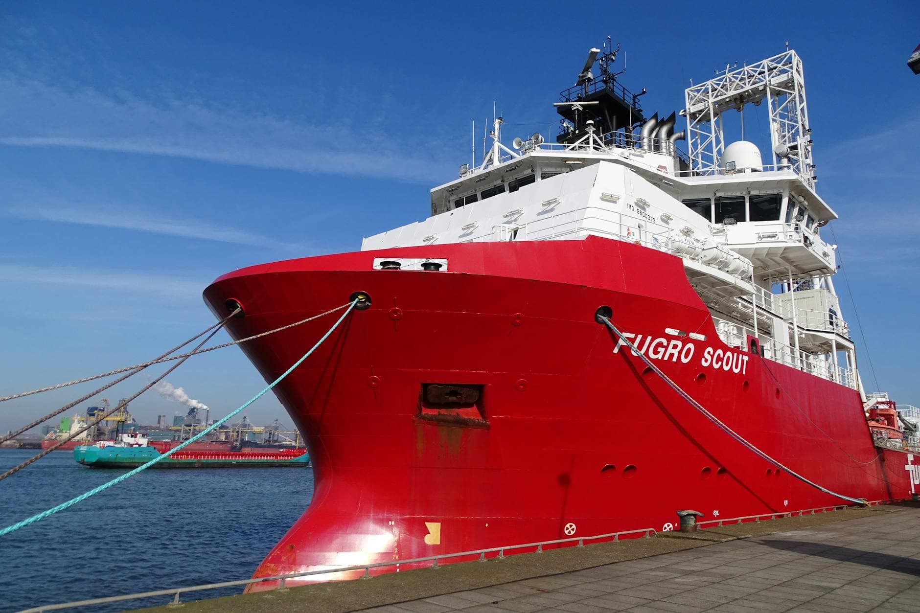 Large red offshore vessel 'Fugro Scout' docked at the harbor in IJmuiden, Netherlands.