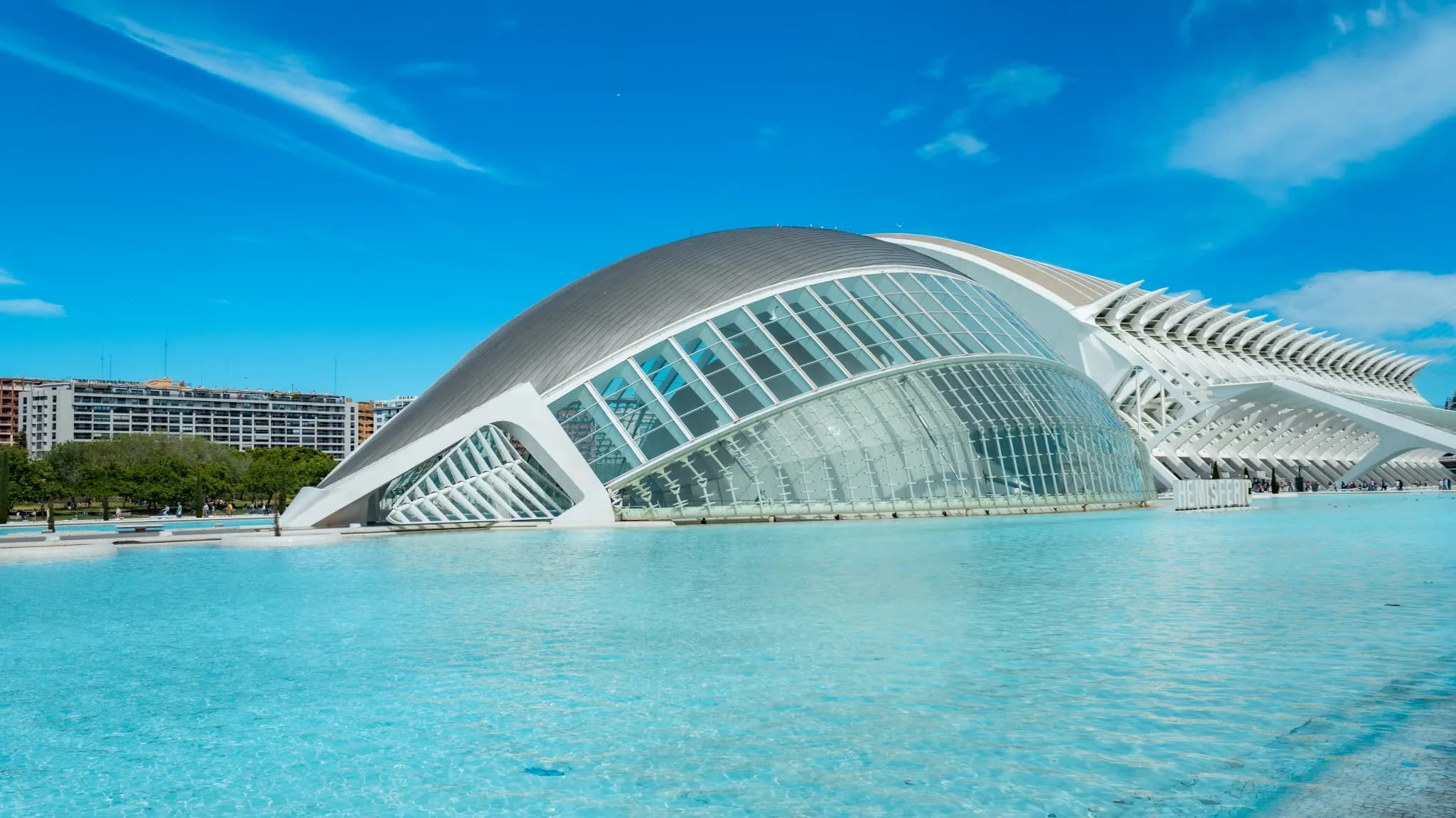Modern architecture reflected in a bright blue pool