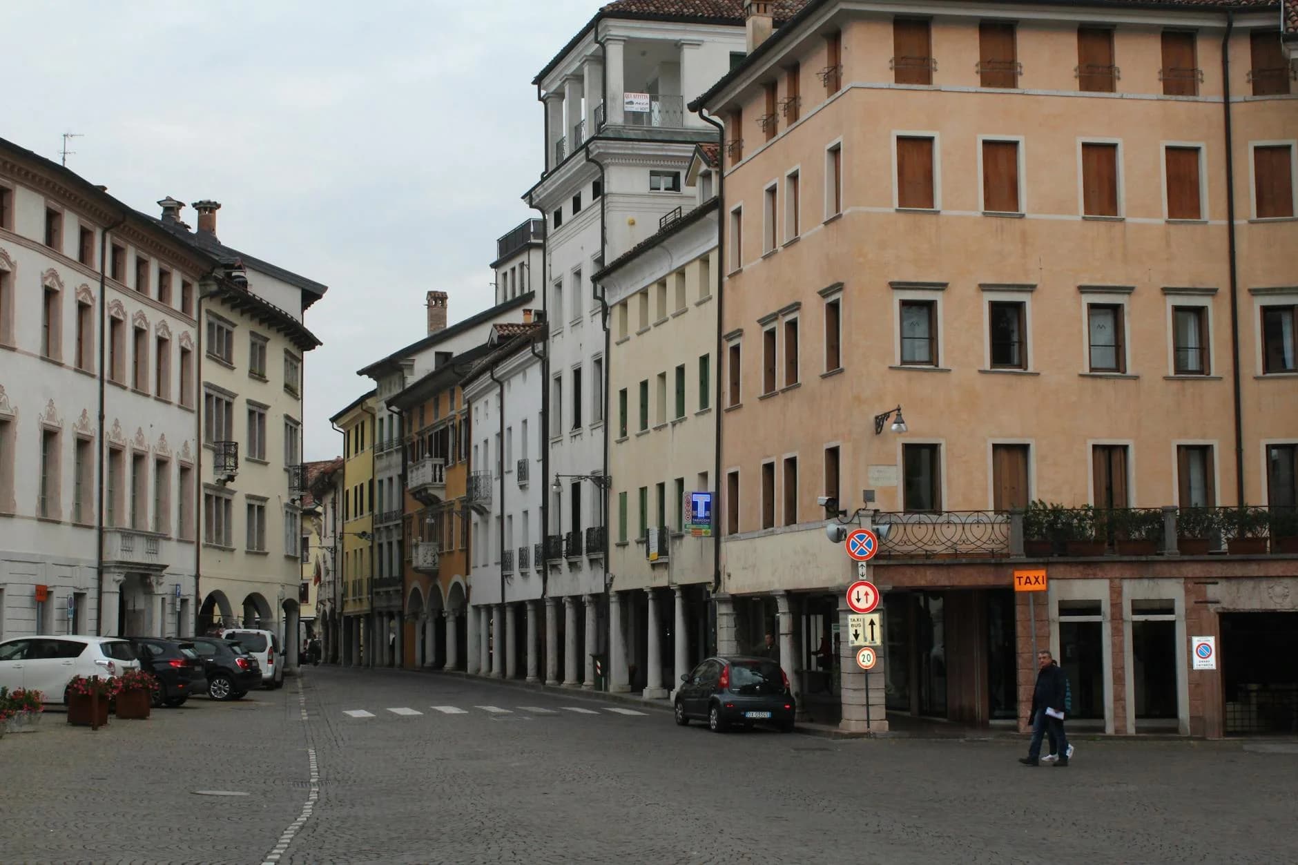Quaint European street with historical architecture in a quiet urban setting.