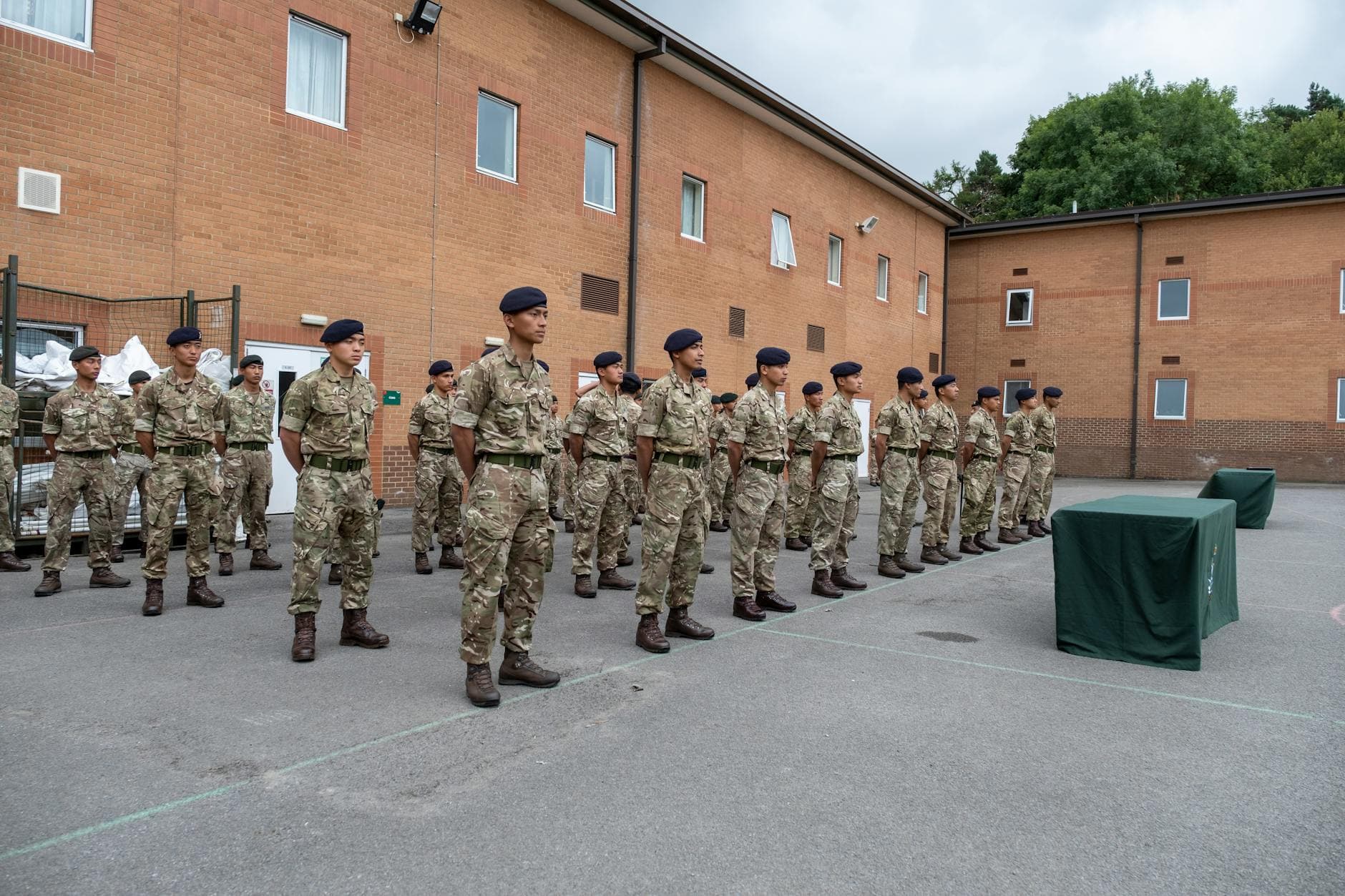 Soldiers in uniform standing in formation at Catterick Barracks, England.