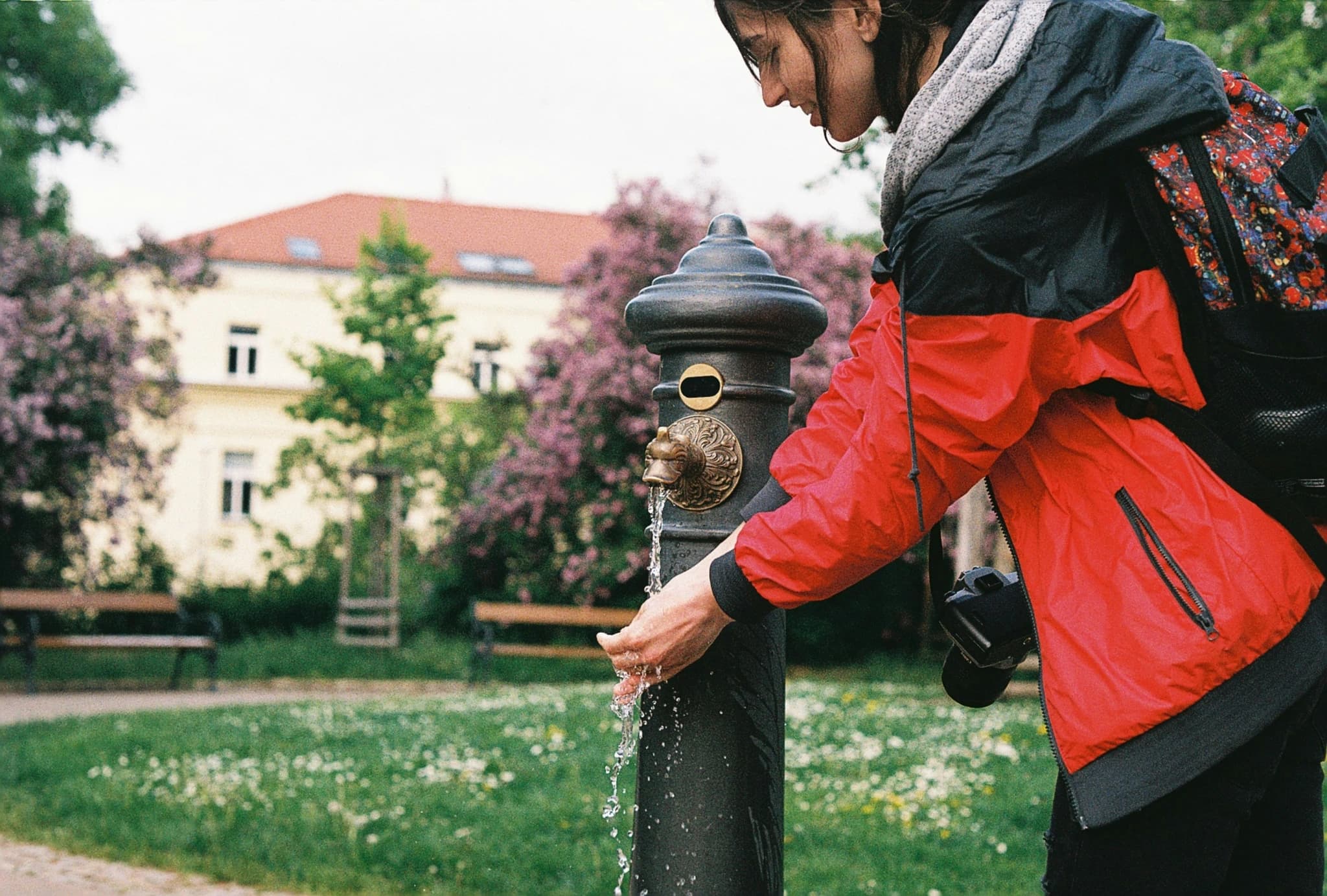 a woman standing next to a fire hydrant