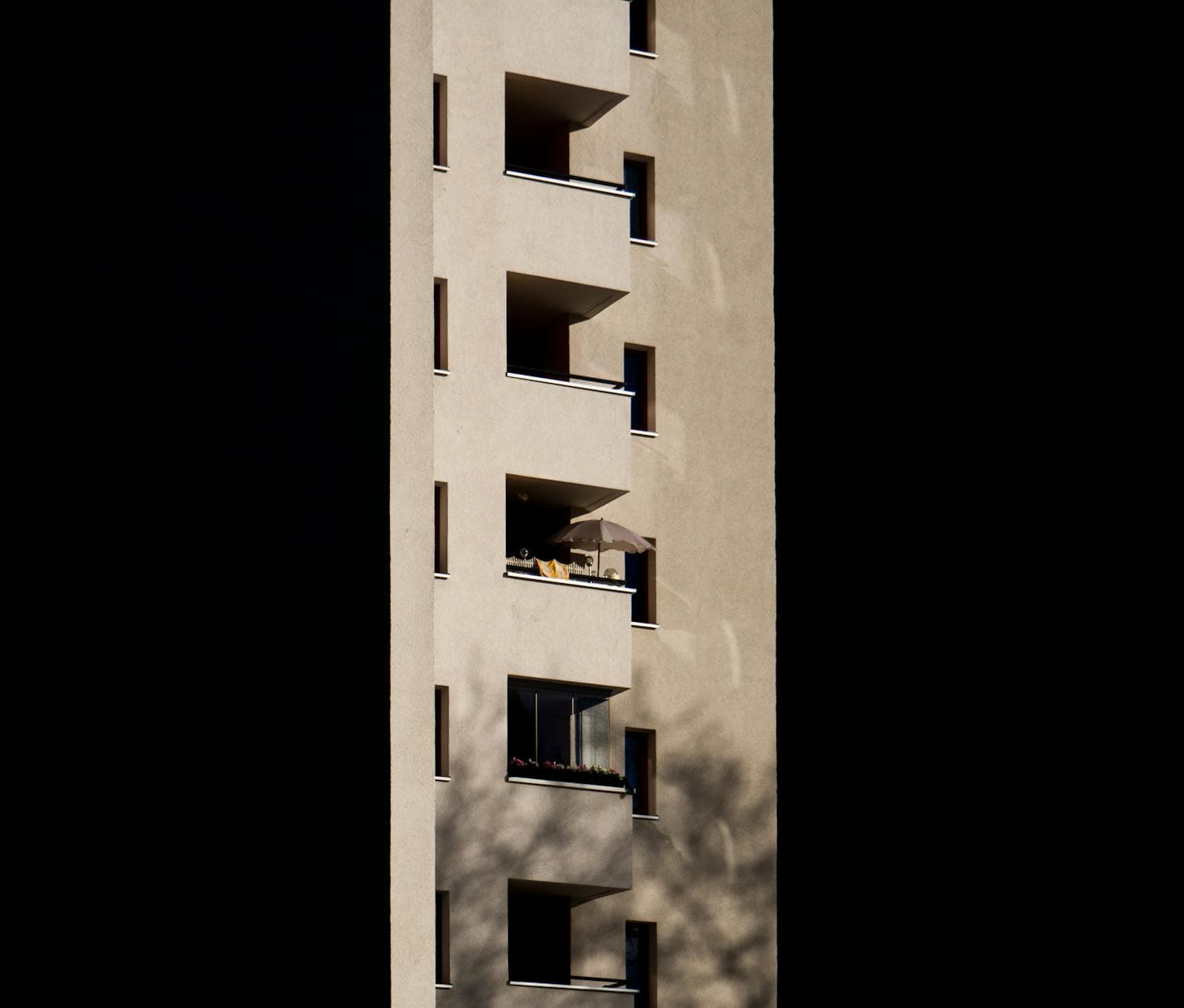 Close-up of a modern apartment building's facade with balconies in Berlin, Germany.